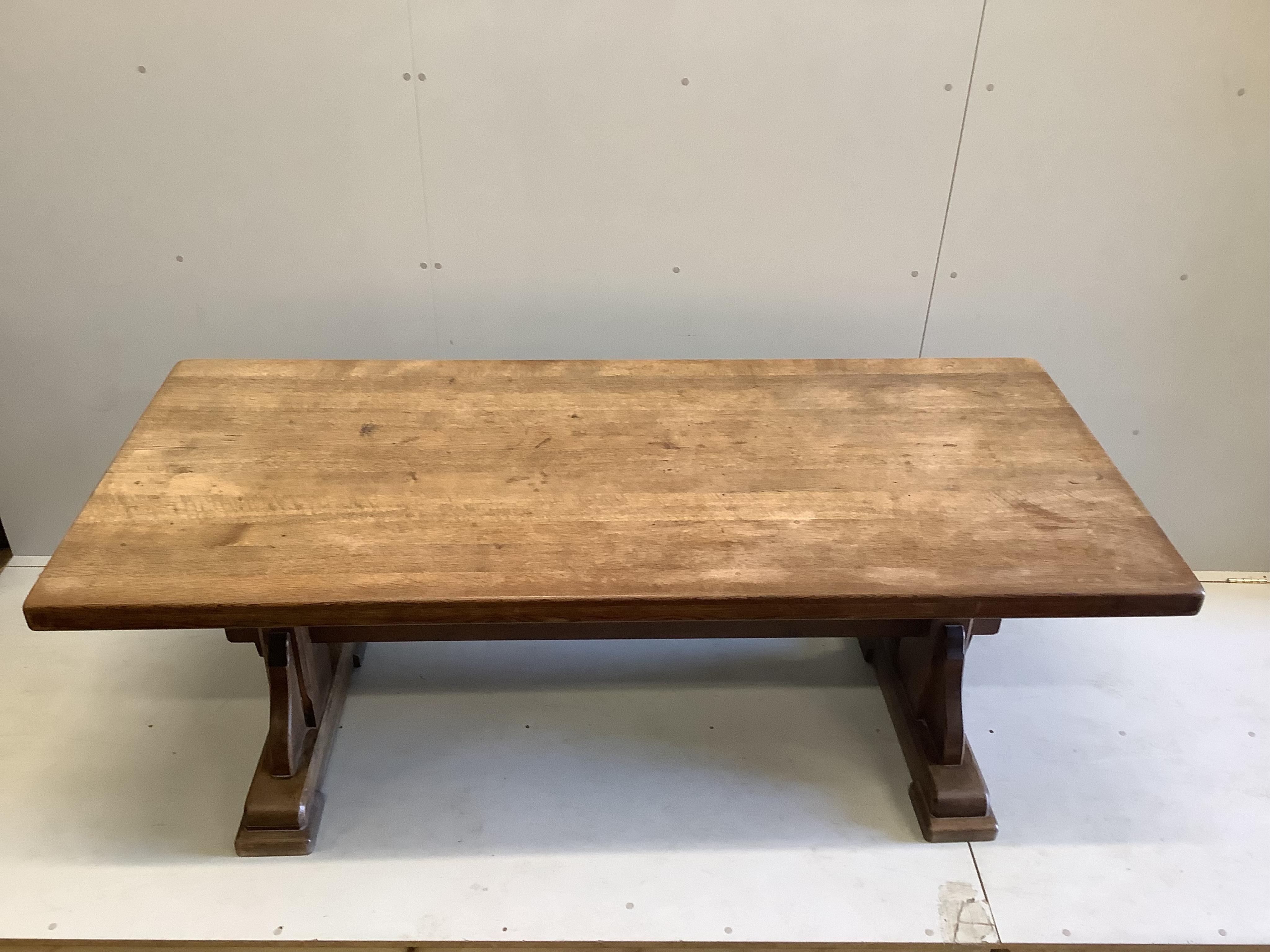 An 18th century style rectangular oak refectory dining table, width 200cm, depth 89cm, height 75cm. Condition - fair